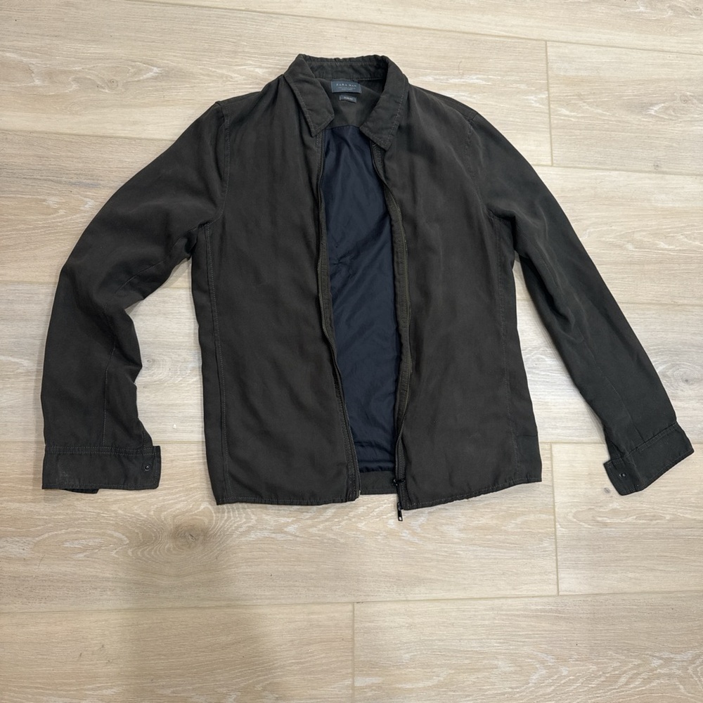Dark green olive color,  lightweight bomber jacket with a relaxed fit